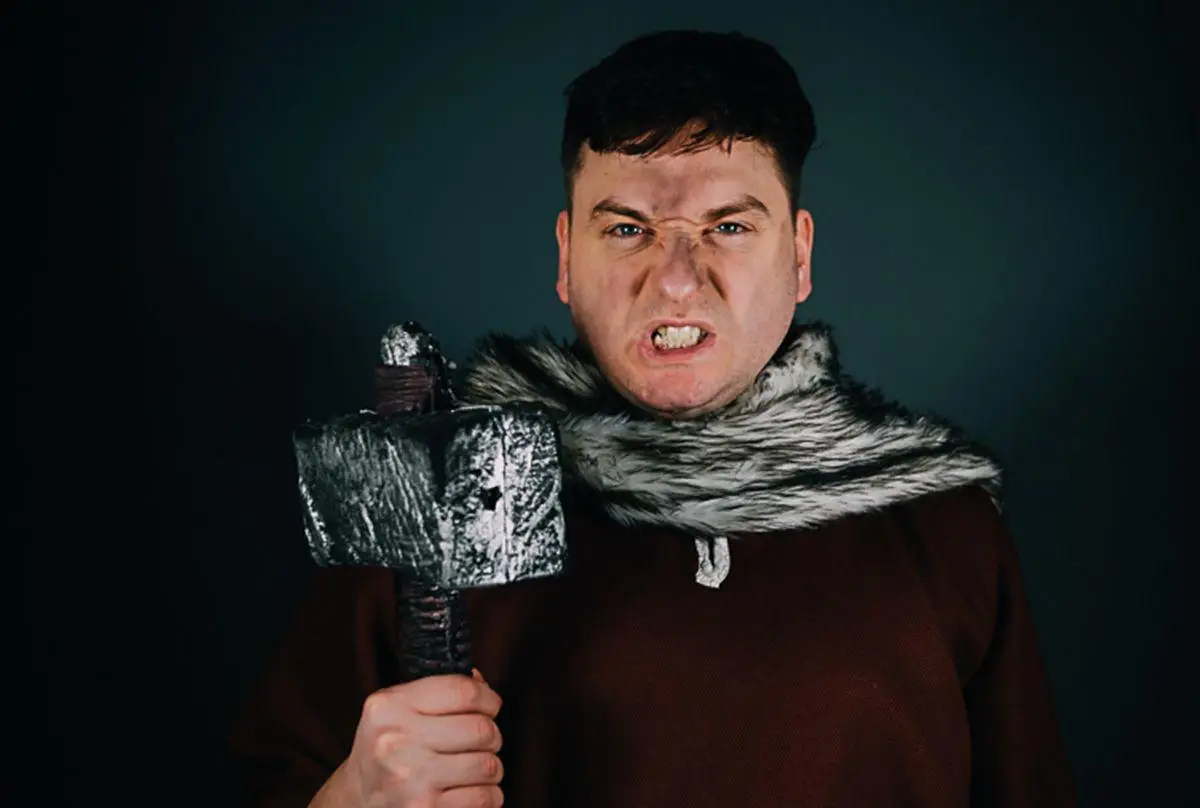 actor dressed as an iron age settler.