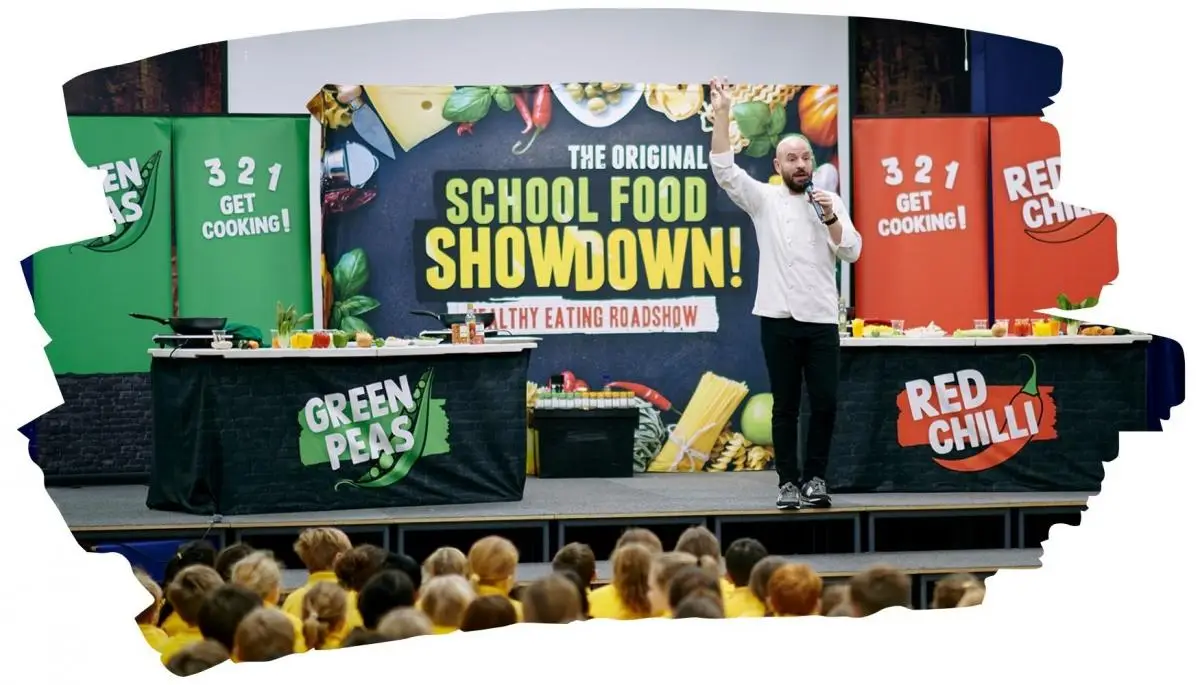 children watching a food demonstration about healthy eating